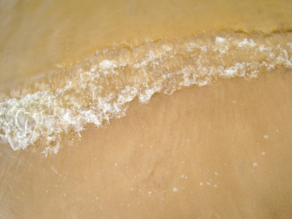 A close up of the bottom portion of an ice cream.