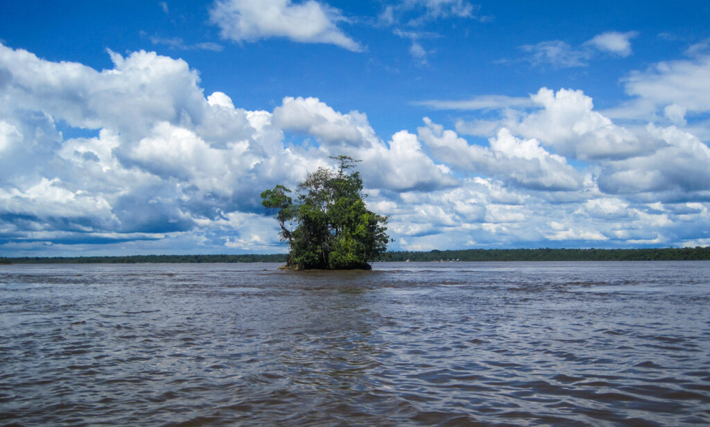 A small island in the middle of a lake.