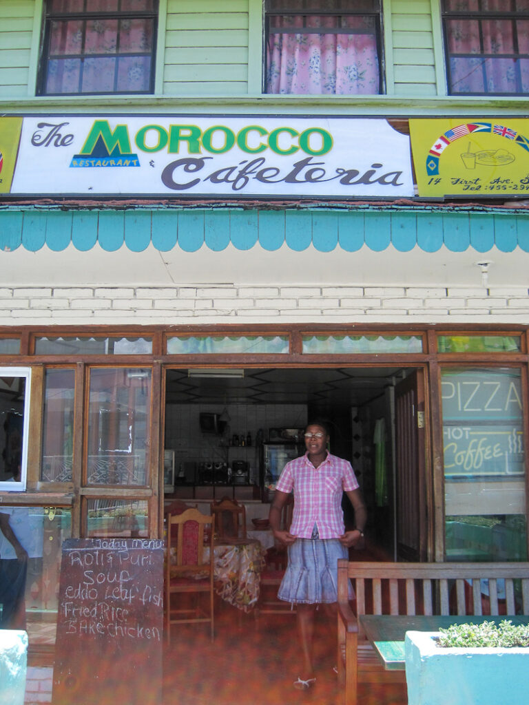 A man standing in front of a store.