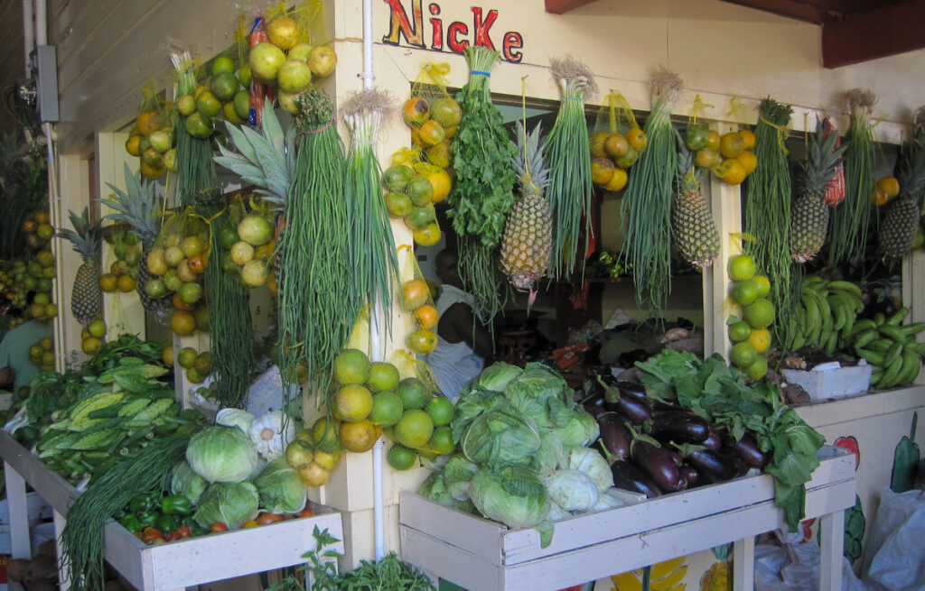 A display of fruits and vegetables in front of nicke 's.