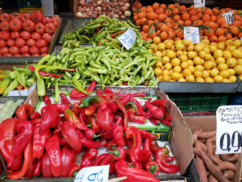 A bunch of peppers are on display at the market