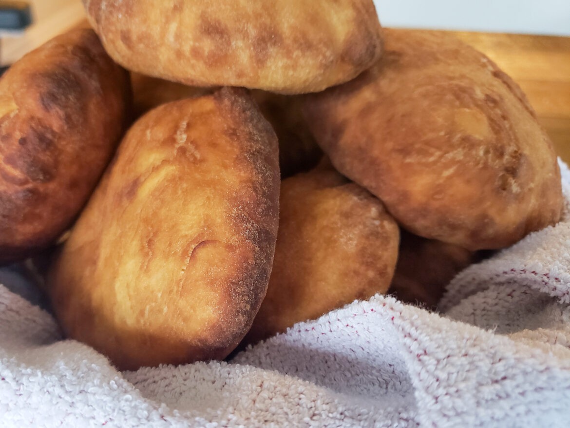 A pile of biscuits sitting on top of a white towel.