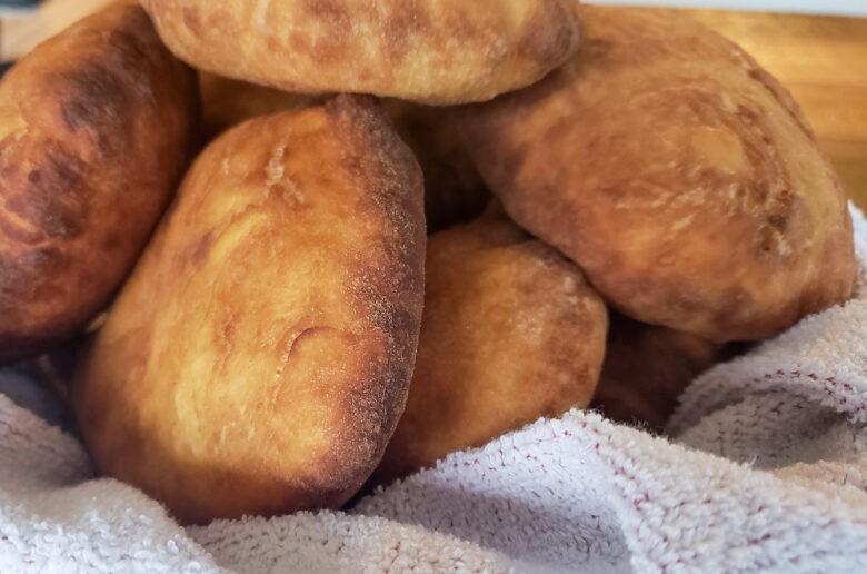 A pile of biscuits sitting on top of a white towel.