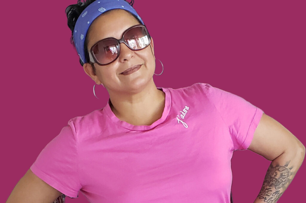 A woman wearing sunglasses and a headband.