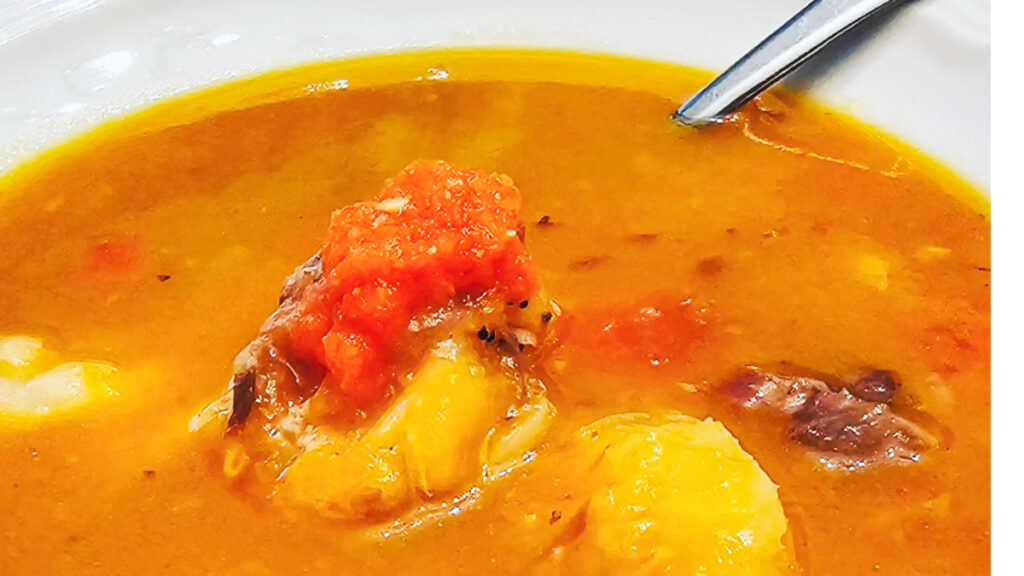 Guyanese soup made with beef and pumpkin soup close up