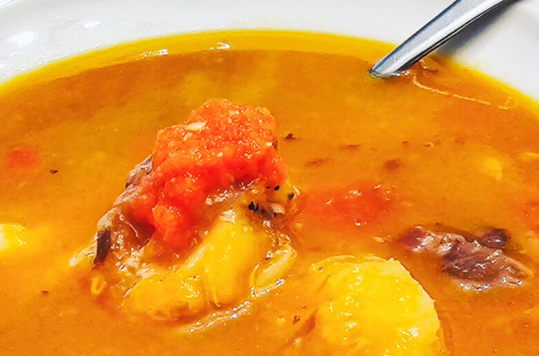 Guyanese soup made with beef and pumpkin soup close up