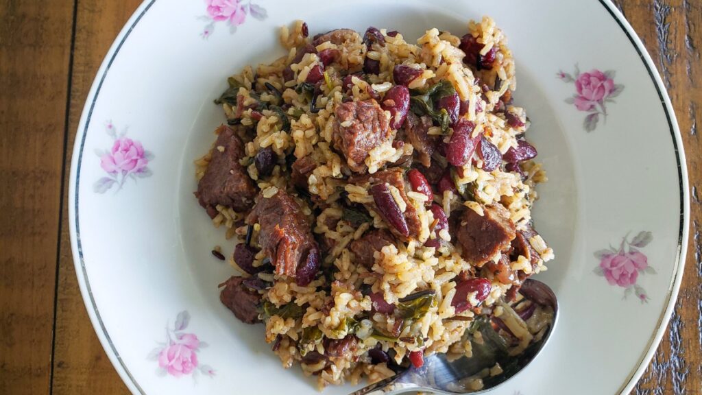 rice and beans in plate decorated with pink flowers