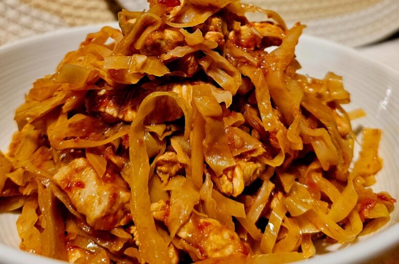 a dish with cooked cabbage and chicken